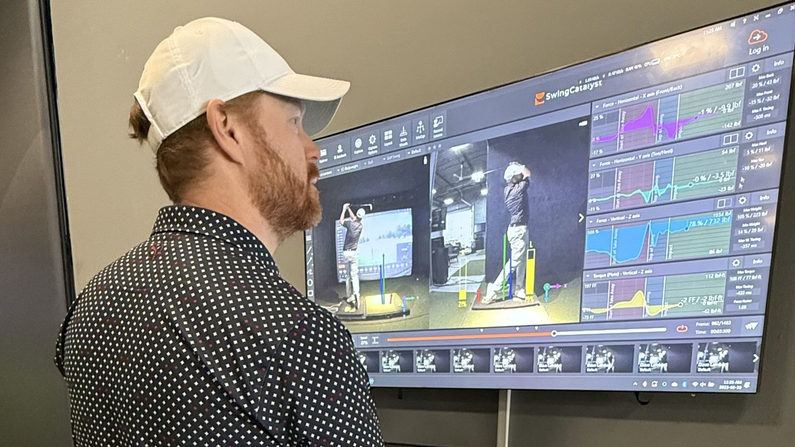 Student reviewing TrackMan compare screen with full data readout