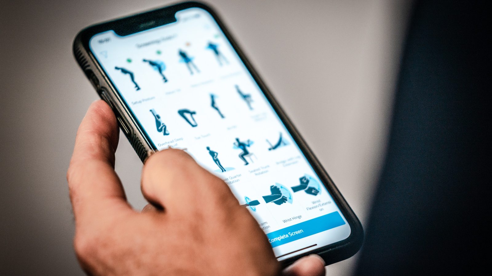 Student performing TPI body assessment with Dave Lambert