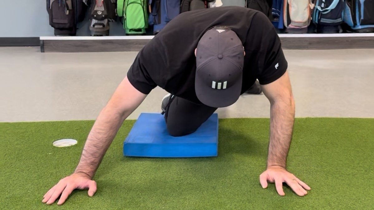 Student performing PVC dowel hip hinge pattern in the integrated training gym