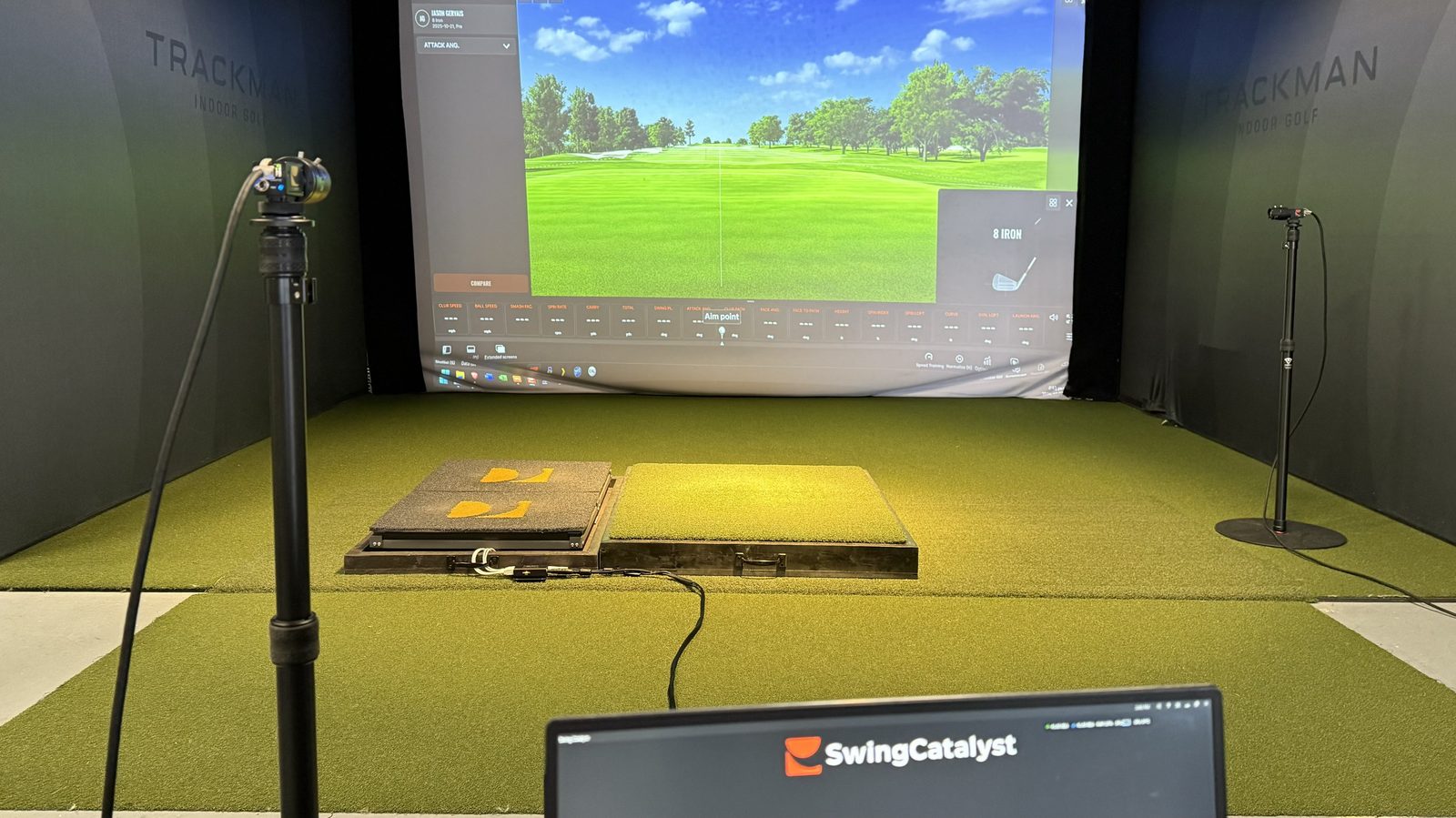 The complete studio — TrackMan screen, Swing Catalyst force plates, laptop, and cameras all integrated